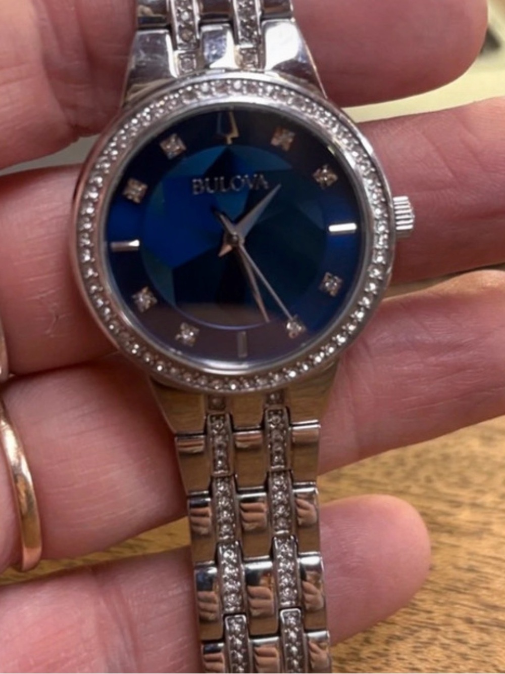 Bulova Silver Bracelet Watch with Deep Blue Faceted Dial and Crystal Accents